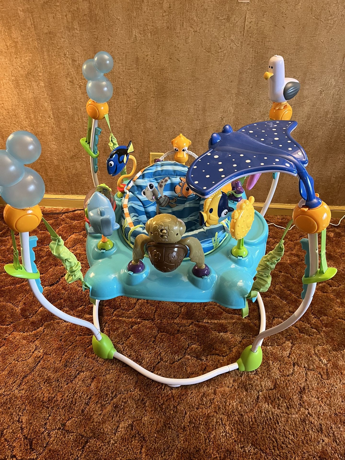 Bright Starts Activity baby Jumper Disney Baby Finding Nemo Sea of Activities.