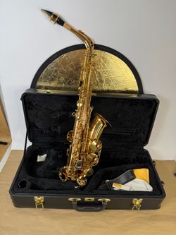 Used slightly damaged student saxophone with case - marked  Davidson