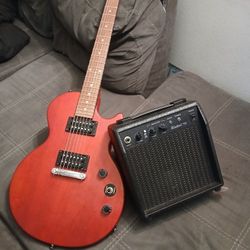 Red Epiphone Guitar With Amp