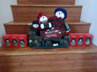Christmas decorations.Brand new Santa’s of the nation hand painted porcelain figurines set of 6 + snowman family on a sled.