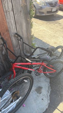 Old red Haro and black Subrosa bmx bikes