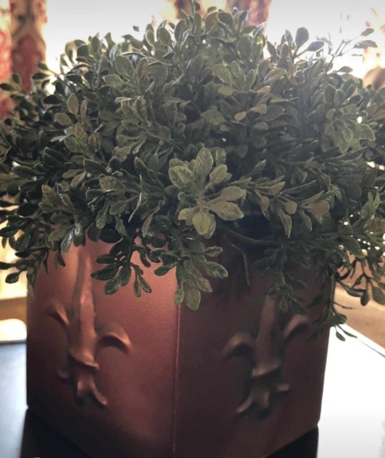 Artificial plant in copper fleur de lis pot