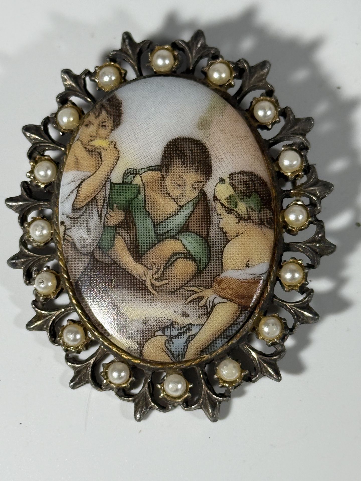 Rare Hand painted porcelain framed cameo brooch