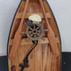 Coast Decor depicting a boat with oars,