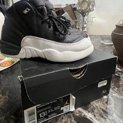 White And black Jordan 12’s Size 13.5c