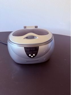 Magnasonic Ultrasonic Jewelry Cleaner, which uses 42,000 Hz ultrasonic