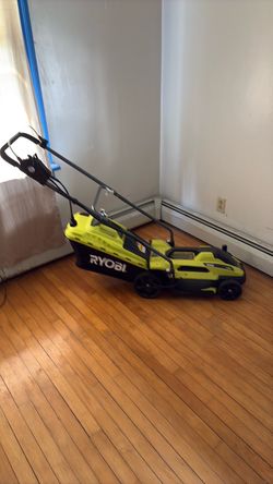 RYOBI 13 inch electric corded lawnmower w/bag. Like new. Used once.