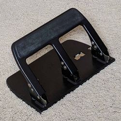 OIC heavy-duty padded handle 3-hole punch with adjustable paper guide and lock-down mechanism