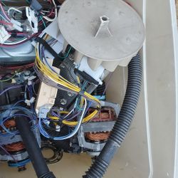 Tote of miscellaneous washer and dryer parts