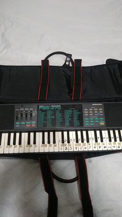 Yamaha pss-270 keyboard with case and books