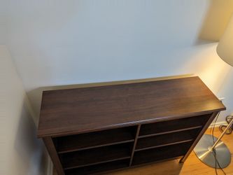 Brown wood TV stand with shelves