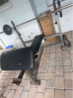 Bench with bicep extension piece 2-35lbs weight 2-25 lbs weight