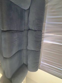 Beautiful greyish sofa.