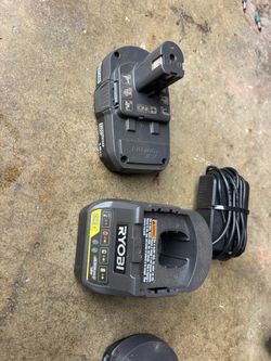 Ryobi 18 V battery and charger and mini rechargeable chainsaw