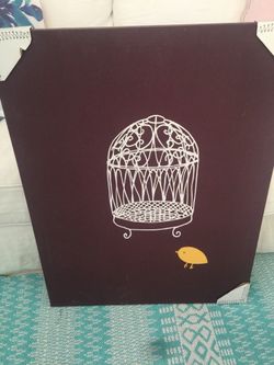 Cute yellow bird with bird cage picture