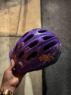 Purple bike helmet with pony’s