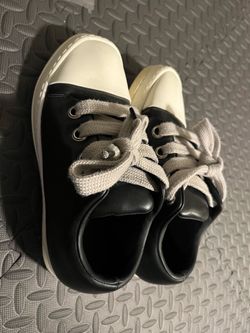 Black Low-Top Sneakers with White Toe Cap