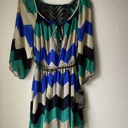 Brand new Woman’s Sequin Hearts brand blue, teal, black, and white colored zig zag dress up for sale