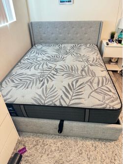 Queen bed frame with lift storage.