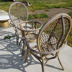 2 wicker chairs and table with no top. I have the other two, one of them is painted kind of grayish and the other is a little bit cracked you can have