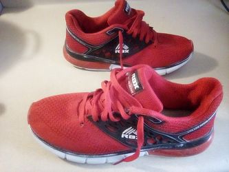 A PAIR OF REEBOK SNEAKERS.