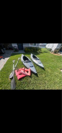 (2) fishing kayaks w/paddles and jackets