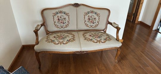 Antique Louis XV style sofa. Made of walnut, decorated with elegant carvings. The upholstery is made of natural wool (high wear resistance) and fixed 