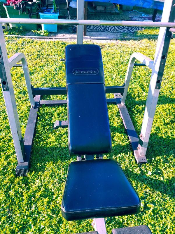 Nautilus! Combination squat rack/ weight bench with Lat Bar pulley and Olympic barbell for