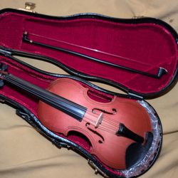 miniature wooden violin