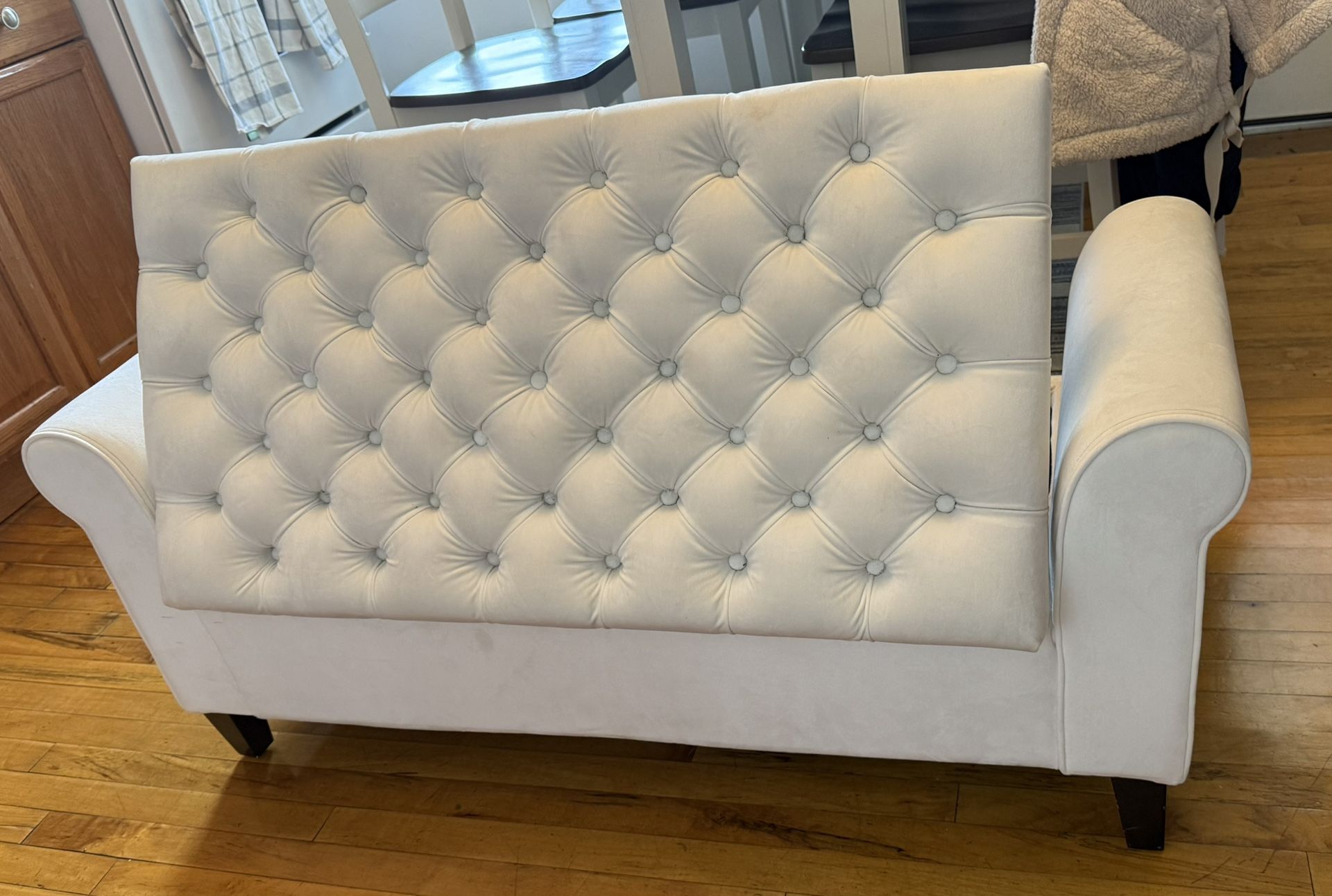 white upholstered velvety storage bench