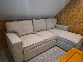 Sectional with chaise and storage. Color is creme