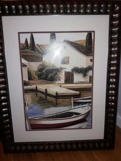 House with boat tied to dock