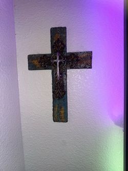 Distressed metal wall cross with ornate center