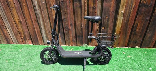 Phantomgogo Commuter R1 seated electric scooter, featuring a rear storage basket and a foldable design.