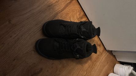 Black Cat Jordan 4s