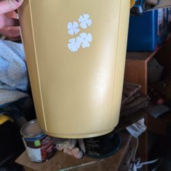 vintage mid-century Rubbermaid waste basket, specifically model #2940, featuring a daisy floral design. 