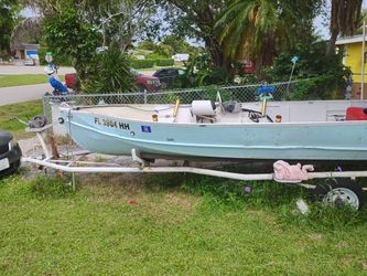 Jon Boat Motor used to work . Probably needs carb cleaning . Good Trailer (contact info removed) call or text
