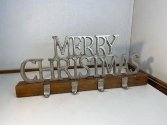 Merry Christmas stocking holder with a wooden stand