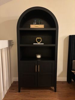 Black Arched Bookcase with Gold Hardware