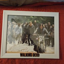 This is an 8 by 10 picture frame with a picture from a calendar of Darrell Dixon guiding the walkers away, From The Walking Dead that I put together ❤