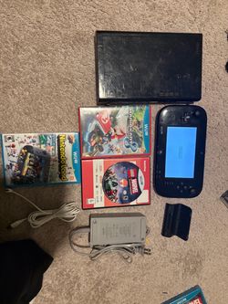 Nintendo Wii U + 8 games (hablo espanol)