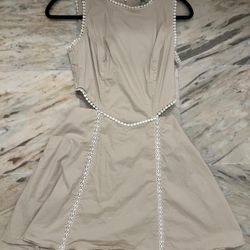 Free cream mini dress with white lace trim and pearl-like beads along the neckline and waistband