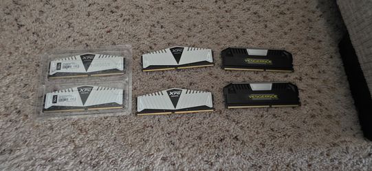 4 White ADATA XPG RAM sticks and 2 Black Corsair Vengeance RAM sticks