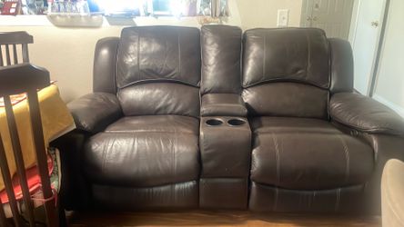 Real Leather sofa 2 seats @ the middle 2 coffee holders Size 80” L 53” H 42” W 23” for seat