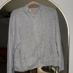 Alo Yoga zip hoodie in grey.