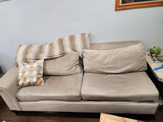 Beige Sectional with pillows and center console