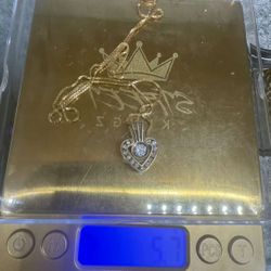 18” Chain an charm  14k 5.7 grams