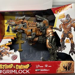 The product is a Hasbro Transformers Age of Extinction Stomp & Chomp Grimlock electronic figure