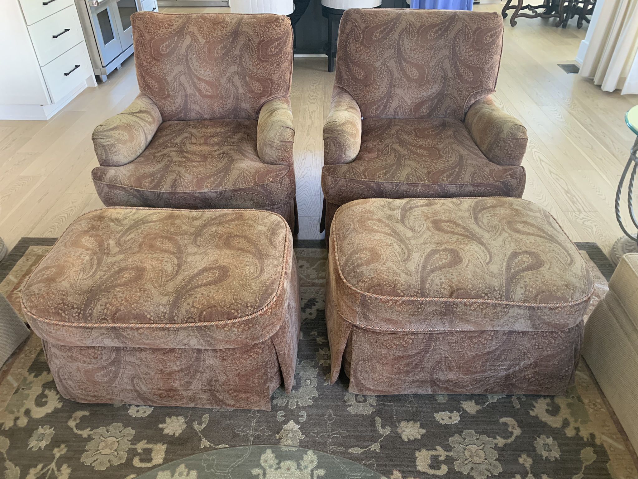 Two Chairs With Ottomans 