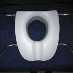 Raised toilet seat